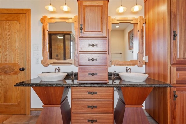 bathroom featuring tile patterned floors and vanity