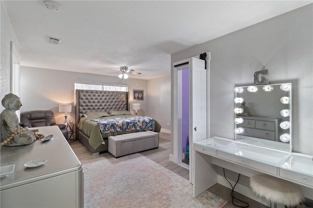 bedroom featuring ceiling fan and light wood-type flooring