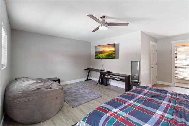 bedroom featuring ceiling fan and light hardwood / wood-style floors