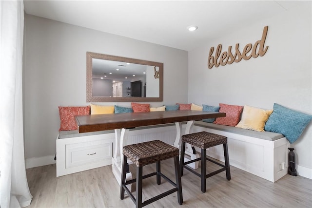 dining area featuring breakfast area and light hardwood / wood-style floors