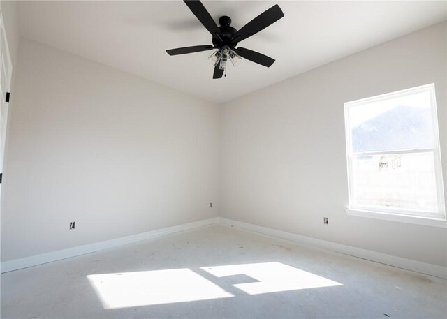 unfurnished room with concrete floors and ceiling fan