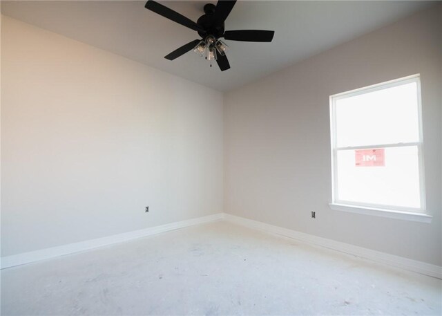 empty room featuring ceiling fan and concrete flooring