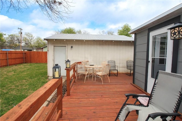 wooden terrace with a yard