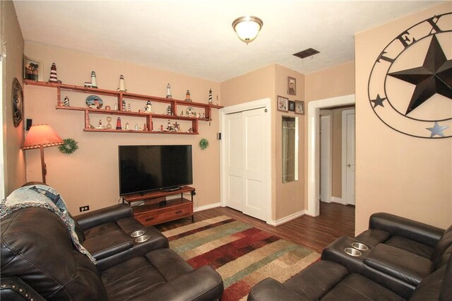 living room featuring dark hardwood / wood-style flooring