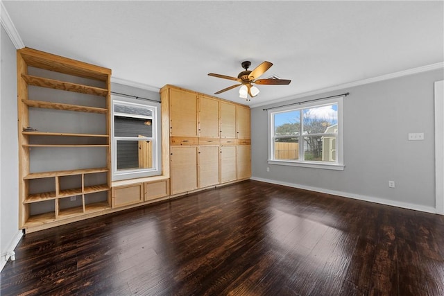 unfurnished living room featuring dark hardwood / wood-style flooring, ornamental molding, and ceiling fan