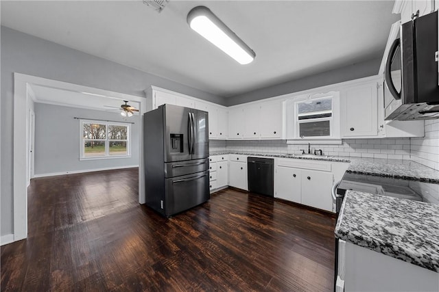 kitchen with white cabinetry, sink, tasteful backsplash, and black appliances