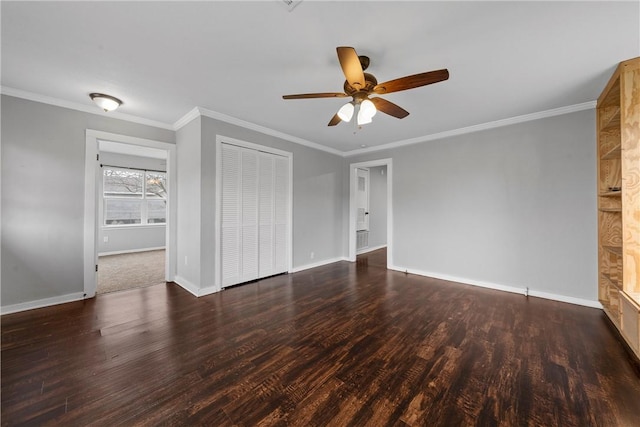 interior space featuring ornamental molding, ceiling fan, and dark hardwood / wood-style flooring