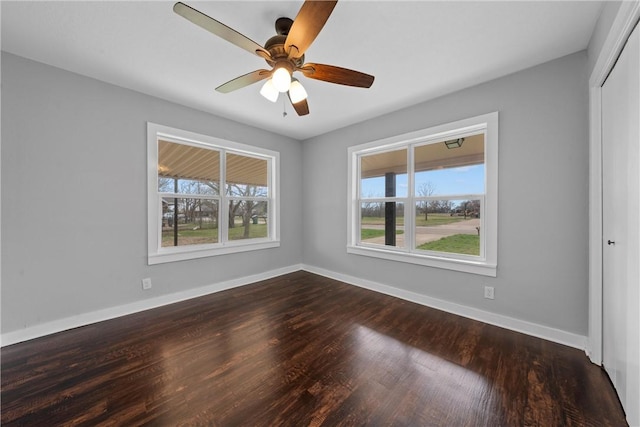 empty room featuring wood-type flooring and ceiling fan