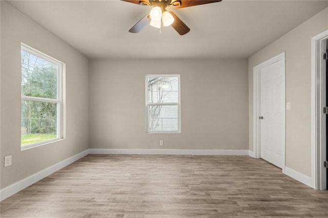 unfurnished room featuring light hardwood / wood-style flooring, ceiling fan, and a healthy amount of sunlight