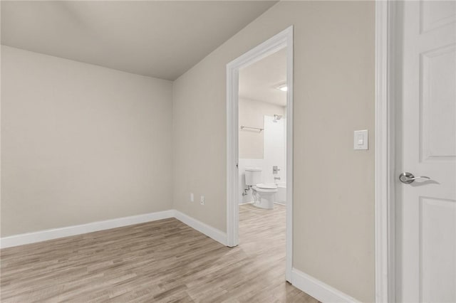 spare room with light wood-type flooring