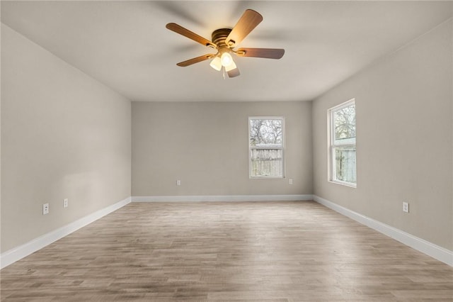 unfurnished room featuring light wood-type flooring and ceiling fan