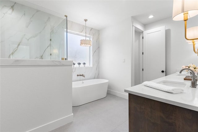 bathroom featuring vanity and a bath