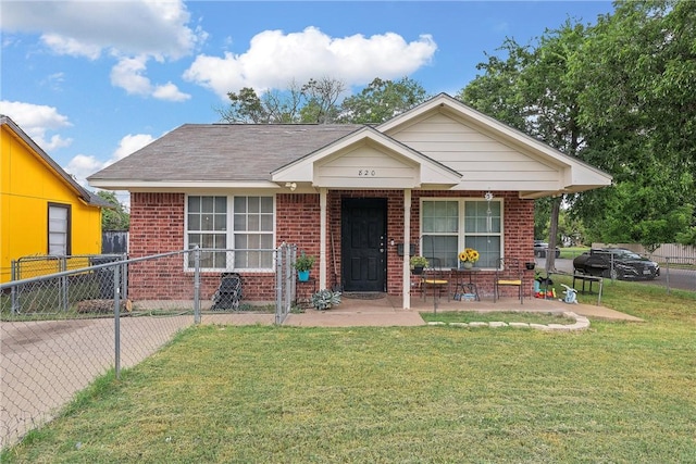 bungalow-style home with a front yard and covered porch