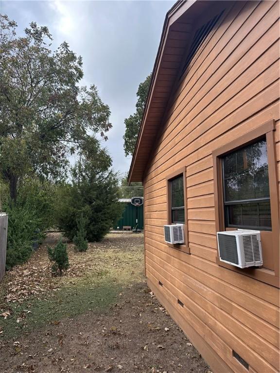 view of side of home with cooling unit