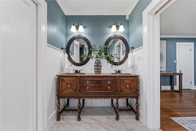 bathroom featuring vanity, hardwood / wood-style flooring, and ornamental molding