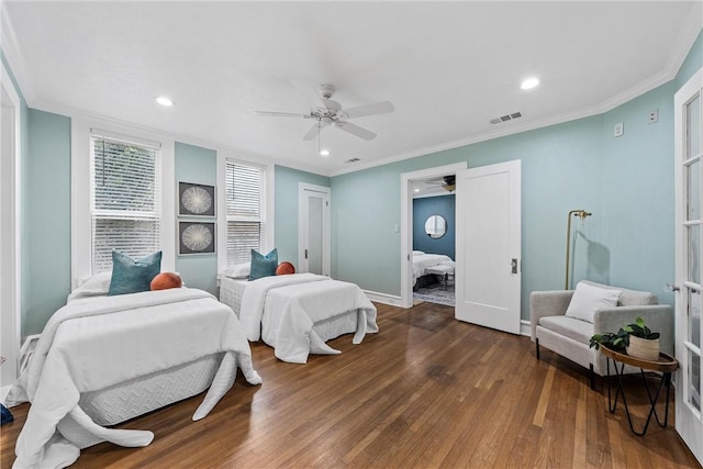 bedroom featuring dark hardwood / wood-style flooring, ceiling fan, and ornamental molding