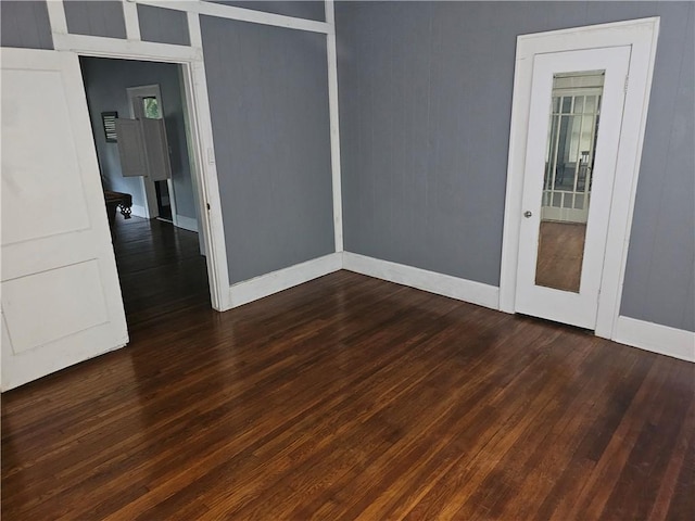 spare room featuring dark hardwood / wood-style floors