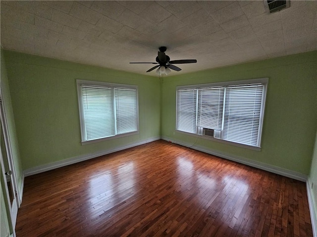 spare room featuring ceiling fan and hardwood / wood-style floors