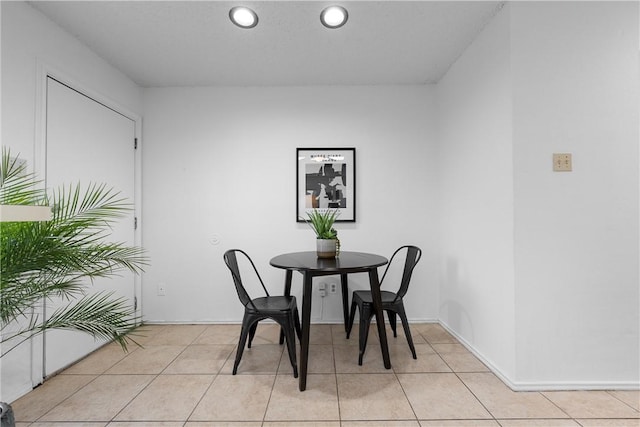 dining area featuring light tile patterned floors and recessed lighting