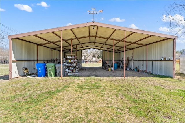 view of vehicle parking featuring an outbuilding