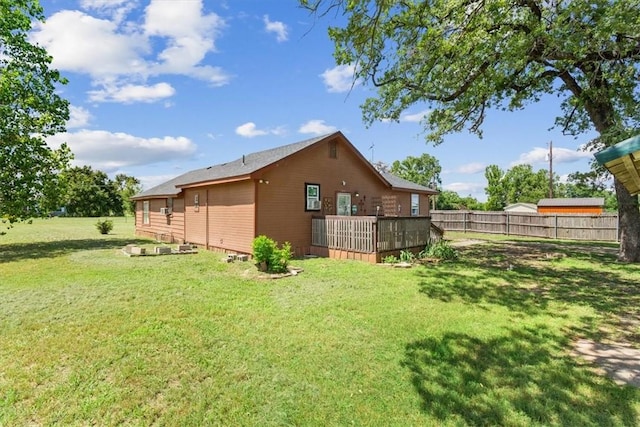 exterior space featuring a yard and a wooden deck