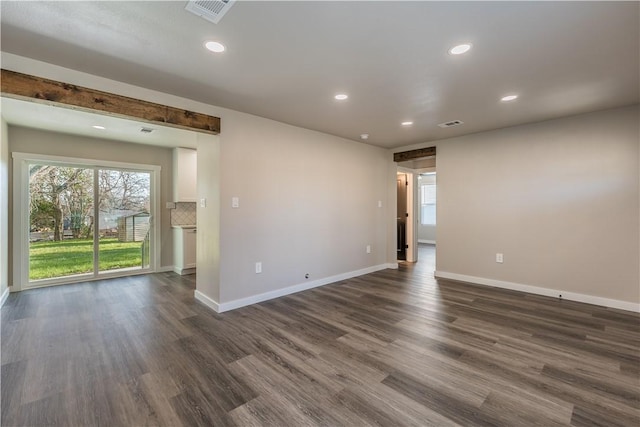 spare room with dark hardwood / wood-style floors