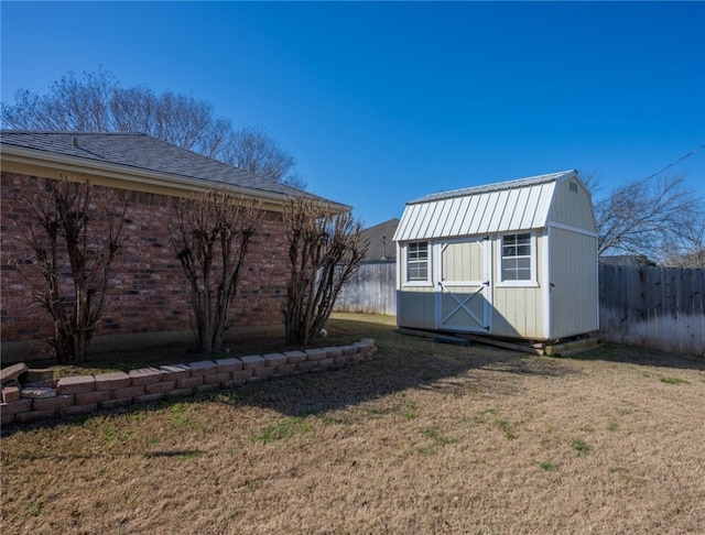 view of outbuilding featuring a lawn