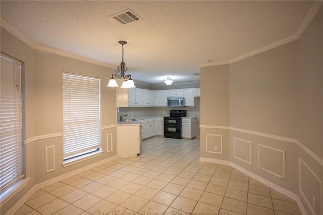 kitchen featuring decorative light fixtures, white cabinetry, range with two ovens, ornamental molding, and light tile patterned flooring