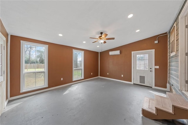 empty room with finished concrete flooring, baseboards, lofted ceiling, and recessed lighting