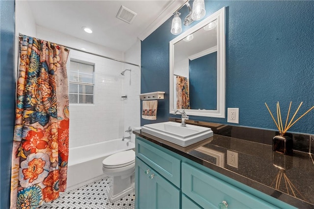 bathroom featuring a textured wall, toilet, vanity, visible vents, and shower / bath combo