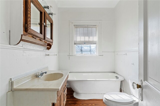 unfurnished room featuring hardwood / wood-style floors and an inviting chandelier