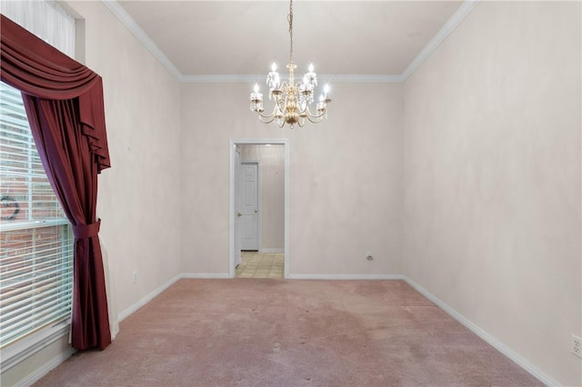 carpeted empty room featuring crown molding and an inviting chandelier