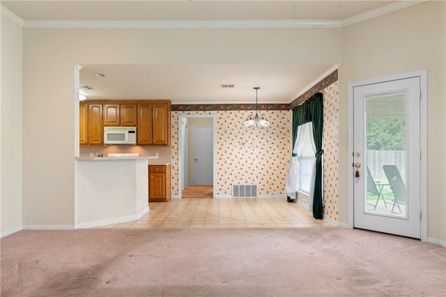 kitchen with light carpet, pendant lighting, a chandelier, and crown molding