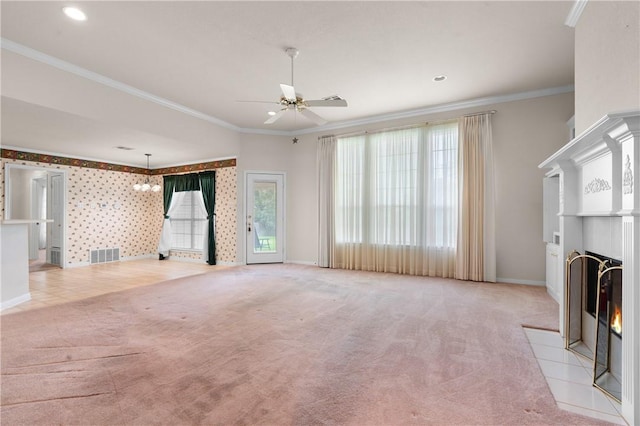 unfurnished living room featuring crown molding, light carpet, and ceiling fan with notable chandelier