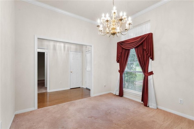 empty room with crown molding, carpet floors, and a notable chandelier