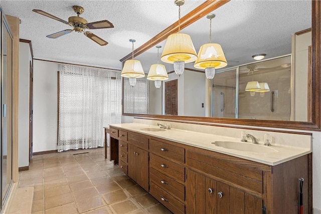 bathroom featuring vanity, tile patterned floors, ceiling fan, a textured ceiling, and a shower with shower door