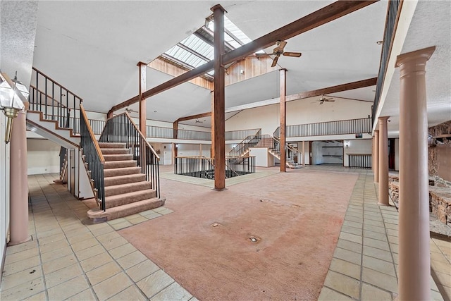 basement featuring tile patterned floors and ceiling fan