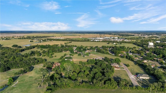 birds eye view of property with a rural view