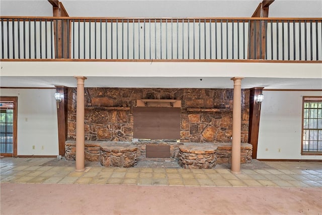 room details featuring carpet flooring and ornate columns