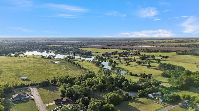 drone / aerial view featuring a rural view and a water view