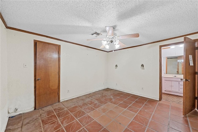 empty room featuring a textured ceiling, ceiling fan, and crown molding