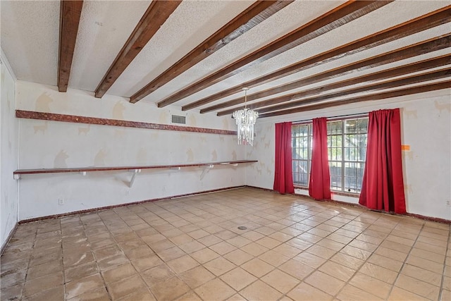 tiled empty room featuring beam ceiling and a chandelier