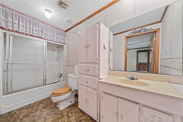 full bathroom featuring parquet floors, a textured ceiling, crown molding, enclosed tub / shower combo, and toilet