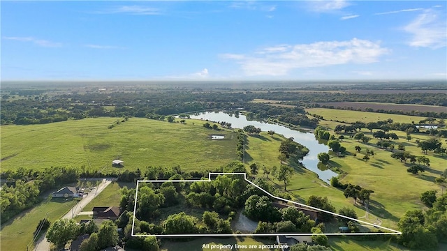 birds eye view of property featuring a water view and a rural view