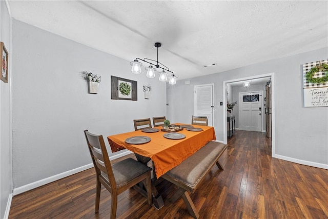 dining room featuring dark wood-type flooring