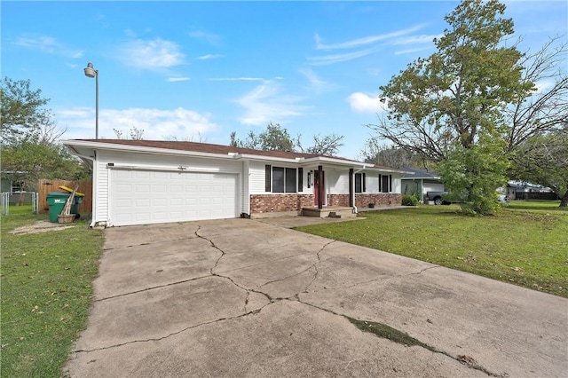 ranch-style home featuring a garage and a front yard