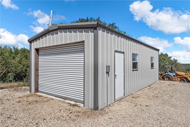 view of outdoor structure with a garage