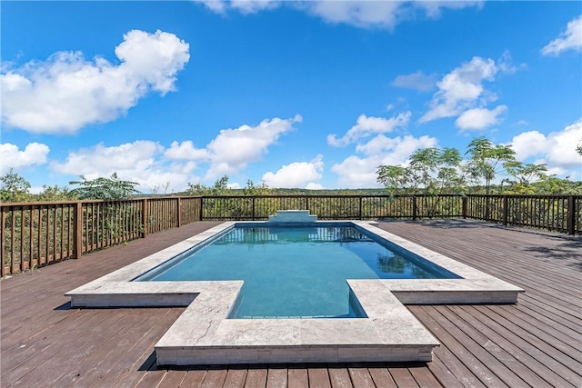 view of swimming pool featuring a wooden deck