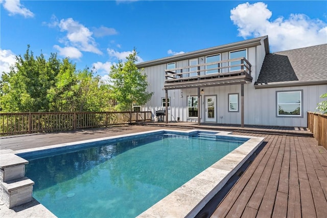 view of swimming pool featuring a wooden deck