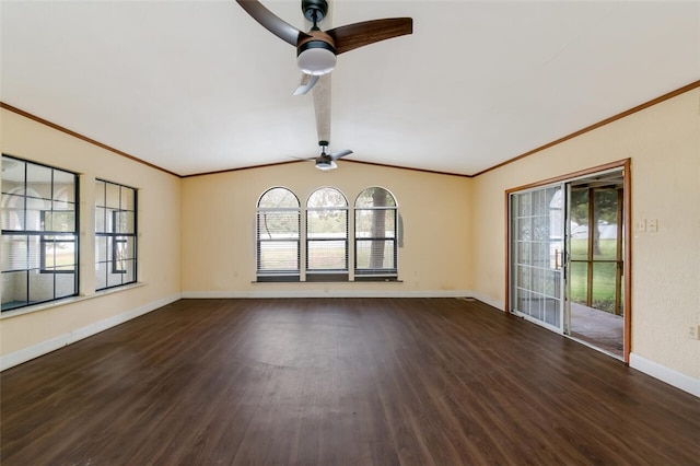 spare room featuring ceiling fan, dark hardwood / wood-style flooring, ornamental molding, and vaulted ceiling